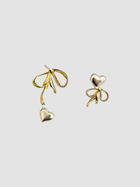 Asymmetrical Love Bow Earrings In Silver