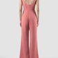Octave coral jumpsuit with scalloped bow and cutout