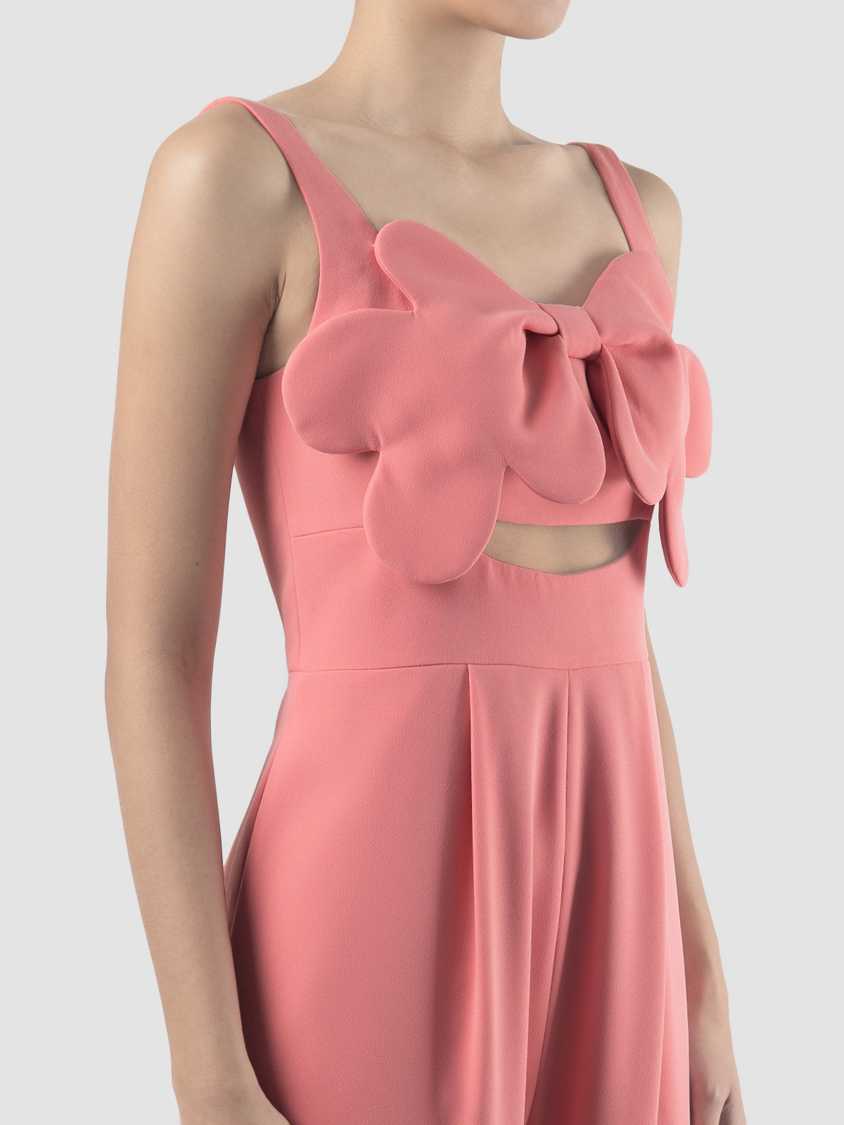 Octave coral jumpsuit with scalloped bow and cutout