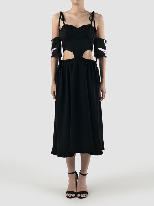 Black corset dress with cutout details and embroidered sleeves