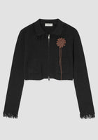 Black knit cropped jacket with sun crochet appliqué