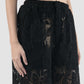 Black lace shorts with floral patterns